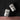 Two floating Gentlemen Smugglers SIPS THC Mixer pouches, 5mg, with illustrated packaging on a black and pink graphic background.